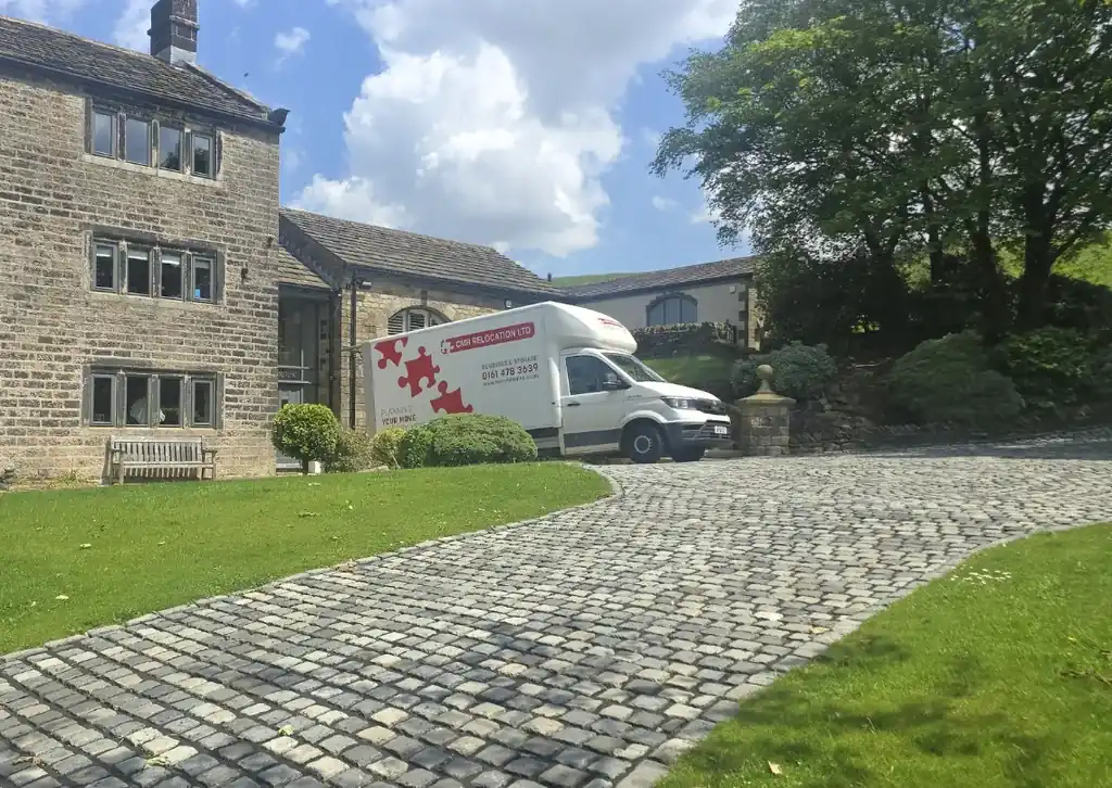 CMR Relocation lorry in the drive of a stone farmhouse