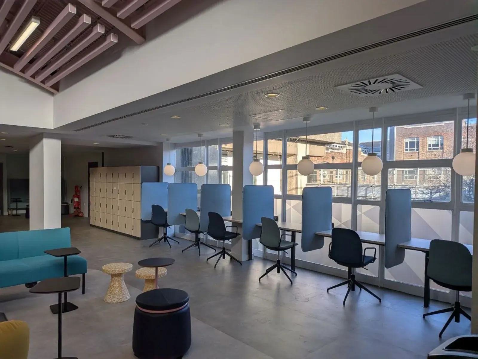 Rows of empty shared desks ready for whoever is in the office that day