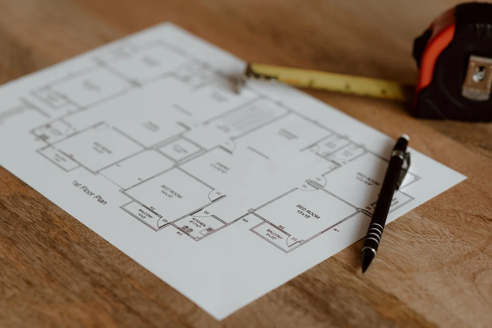 Floor plan and tape measure used when choosing office space and measuring each room