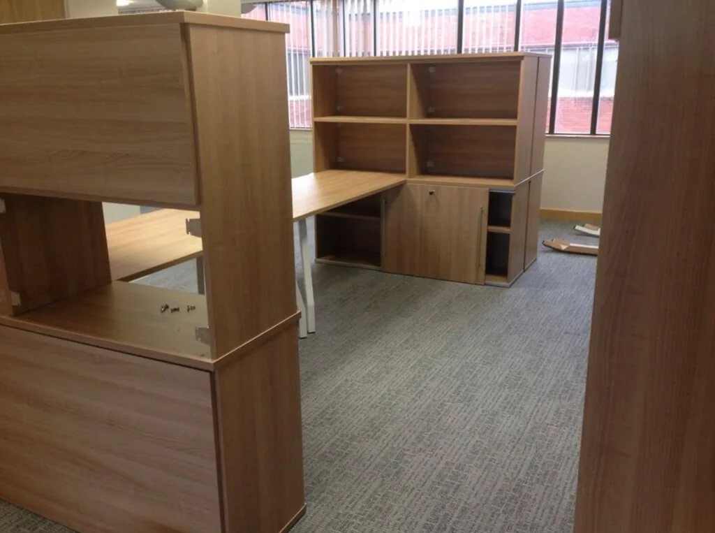 Wooden office desks and storage installed in a new office by our crew