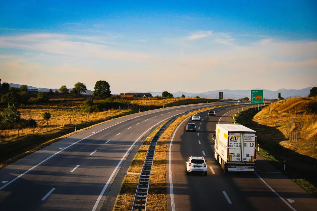 Lorry travelling along a European motorway at golden hour