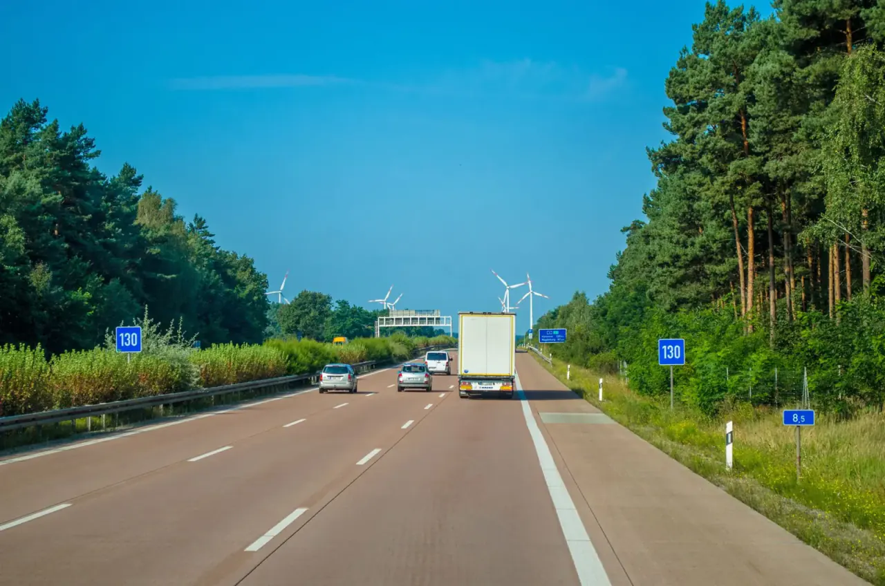 White lorry on a motorway on a sunny day