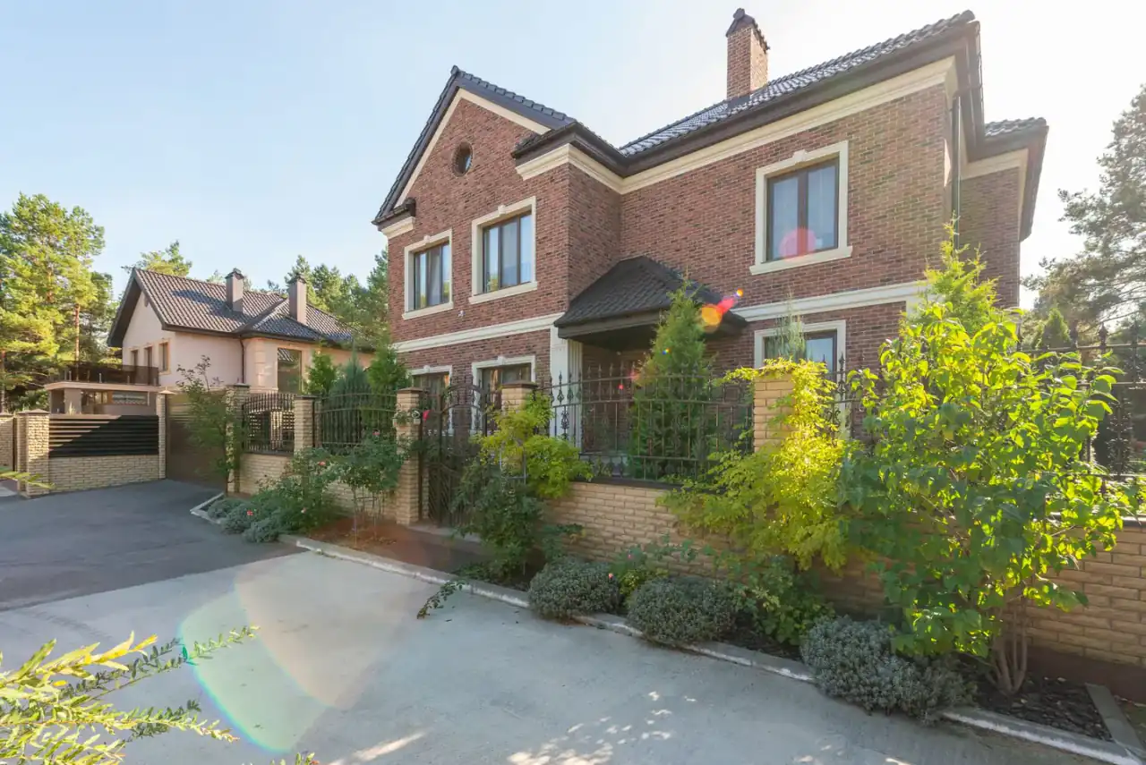Modern detached brick house with a landscaped front garden