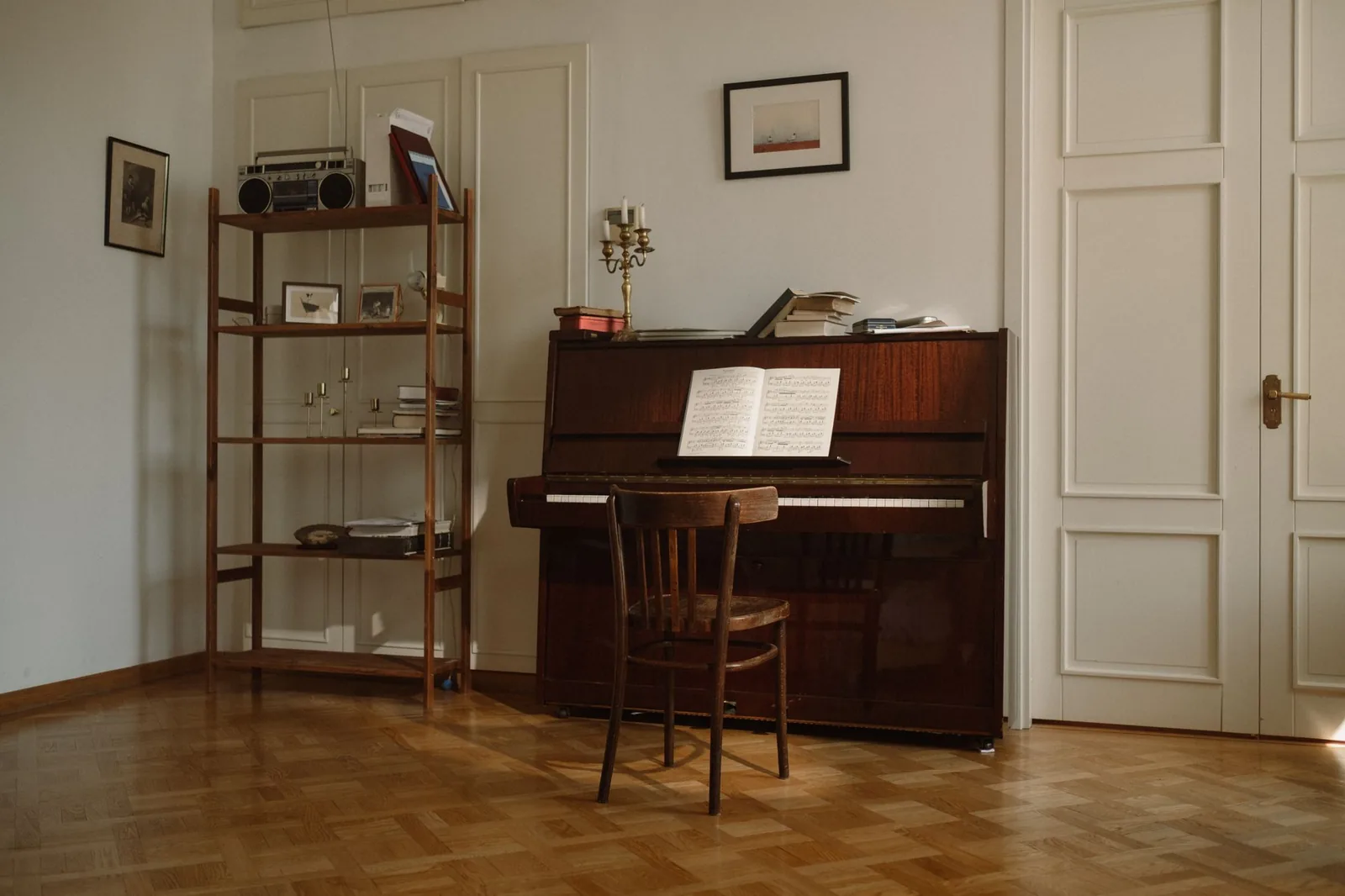 Wooden upright piano and chair in a bright living room