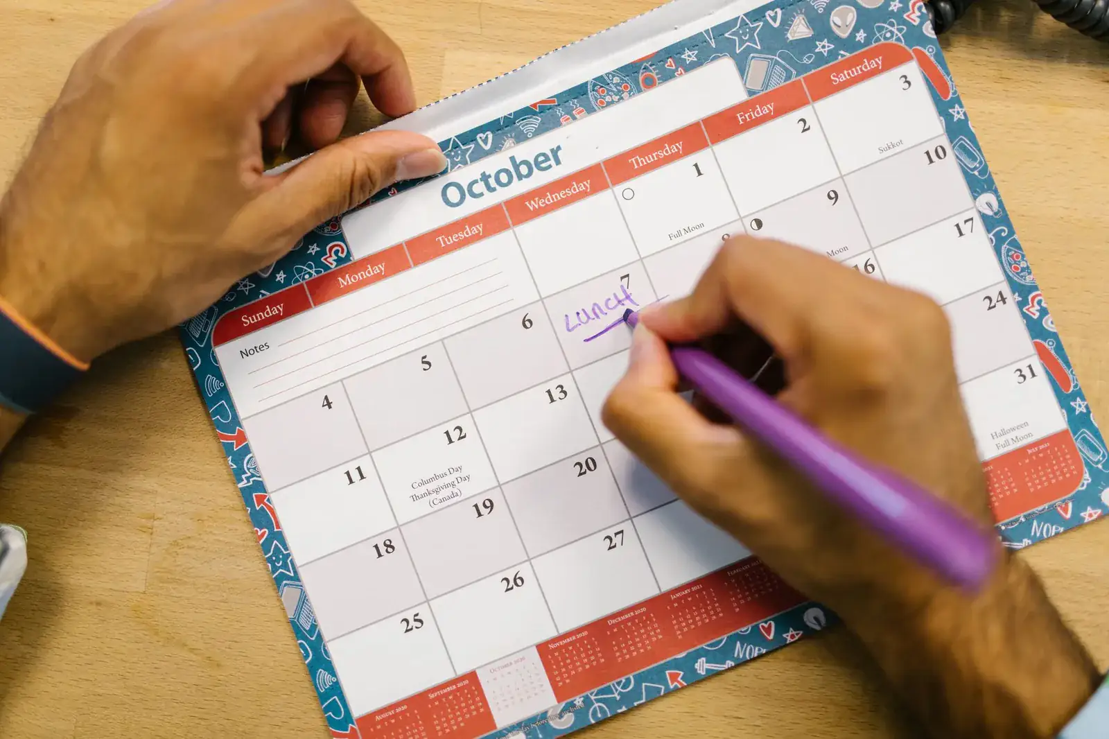 Moving date marked on a paper calendar, ready to give to two councils